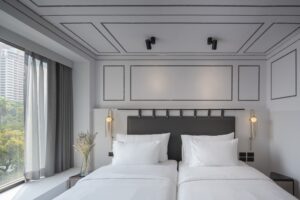 20. Room Stylish modern twin room in Bangkok featuring minimalist decor - PASSA HOTEL BANGKOK