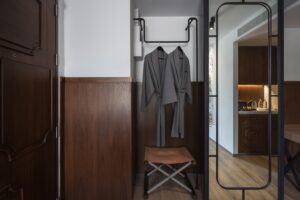 22. Room Deluxe King Room wardrobe corner with bathrobes and full length mirror at Passa Hotel Bangkok in Silom - PASSA HOTEL BANGKOK