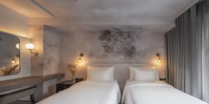 23. Room Boutique Bangkok hotel room with twin beds soft furnishing cozy lightling and artistic design details - PASSA HOTEL BANGKOK
