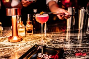 33. Restaurant Bar Handcrafted drink at luxurious Bangkok hotel bar with upscale ambiance Rogue Affair Bar Bangkok 1 - PASSA HOTEL BANGKOK